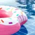 pink swimming matress on pool